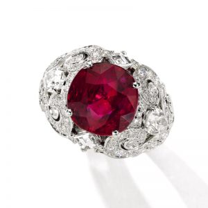 Superb ‘pigeon blood’ Burmese ruby and diamond ring, Cartier, set with a cushion-shaped ruby weighing 8.37 carats. From a Distinguished Private Collection.