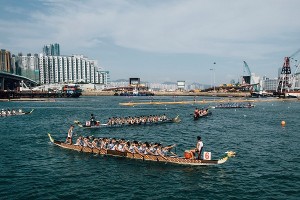 HONG KONG - JULY 05:  Competitors paddle their boats during the Hong Kong Dragon Boat Carnival Race on July 5, 2015 in Hong Kong, Hong Kong. The Hong Kong Dragon Boat Carnival will be staged from 3 July 2015 (Friday) to 5 July 2015 (Sunday). The carnival featured two key programmes: the CCB (Asia) Hong Kong International Dragon Boat Races in Victoria Harbour and the San Miguel BeerFest at the UC Centenary Garden in East Tsim Sha Tsui.  (Photo by Anthony Kwan/Getty Images for Hong Kong Images)